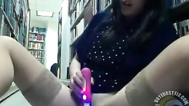 Asian nymph masturbates with vibrator in library POV