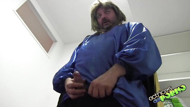 Shaggy haired man in shiny blue gown stroking cock on stairs POV
