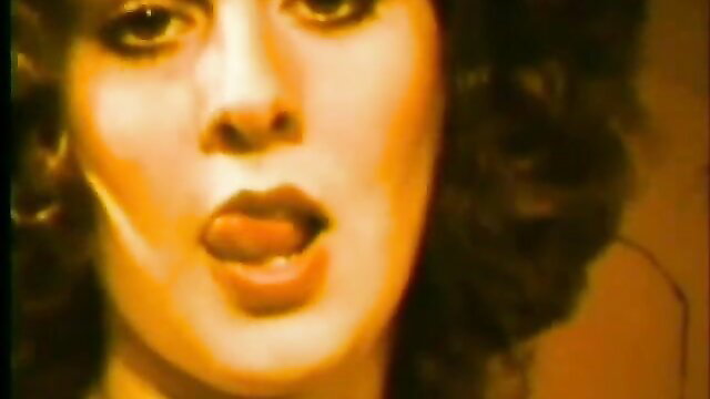 Vintage brunette bombshell teases with tongue out, classic porn closeup