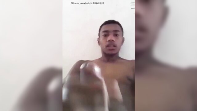 Fijian twink shirtless closeup, hand near crotch in solo tease