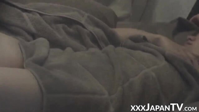 Pretty Asian babe in robe slides fingers into wet pussy on hidden cam