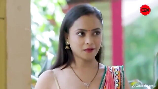 Hot Indian bhabhi in saree with deep cleavage, seductive smile