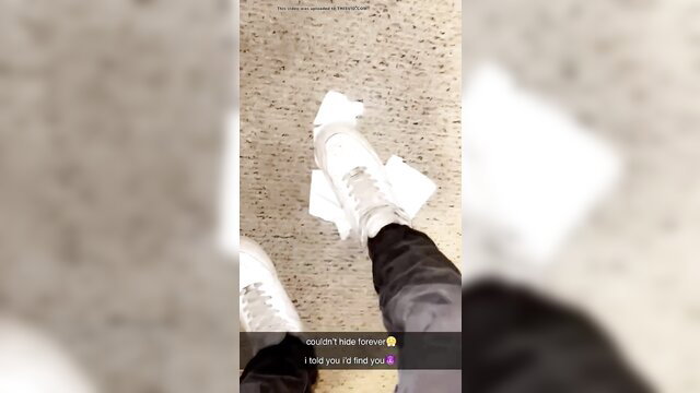 Woman's feet in white sneakers stepping on white paper, trapped destroyed fetish