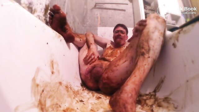 Gay man in tub smears full body with scat and cum, kinky fetish closeup