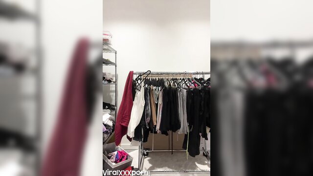 Mia Khalifa teases by clothing rack in tight red dress