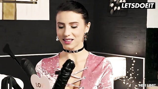 Nelly Kent in pink lingerie choker holds huge black dildo teasing anal