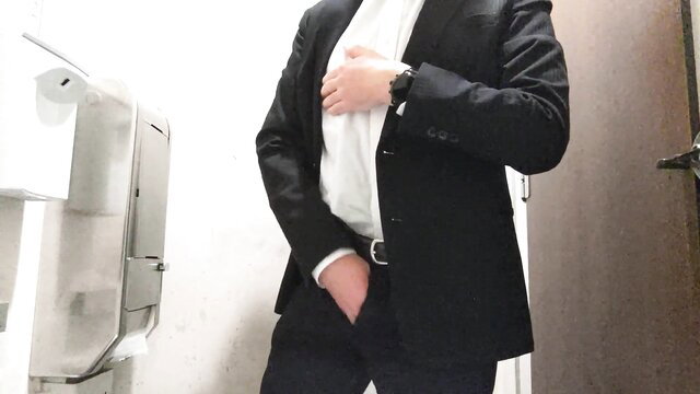 Suit businessman hand in pants masturbating in public toilet