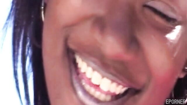 Naughty black hot MILF smiling seductively closeup