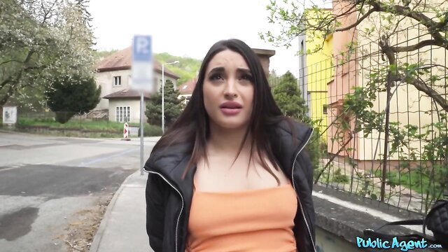 Sara Diamante in black jacket and orange top on Public Agent street