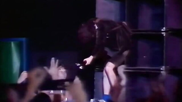 Bon Scott AC/DC lookalike rocks stage in sexy skirt, porn parody