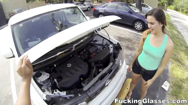 Hot brunette teen in tank top and shorts by open car hood POV