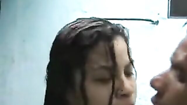 Wet brunette teen passionately kissing man in rain shower sex scene