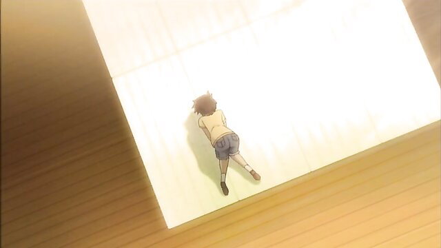 Anime boy in shorts lying on floor in Mujaki no Rakuen Ep.2 hentai scene