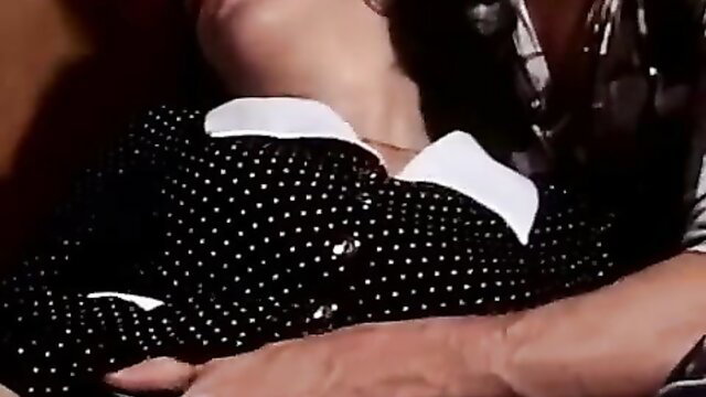 Vintage Danish XXX closeup of busty brunette in polka dot dress