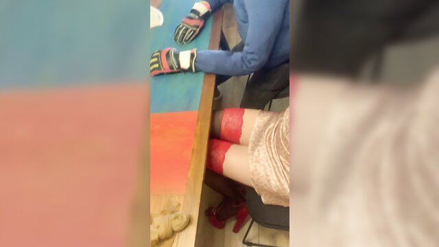 Man in gloves touches stranger's red stockings legs at bar in gay video