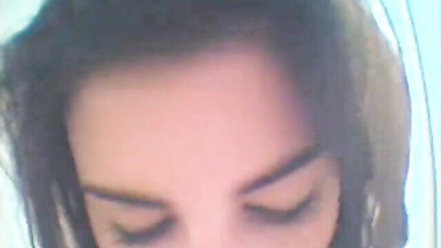 Closeup of amateur brunette's face in white bra during hard punishment