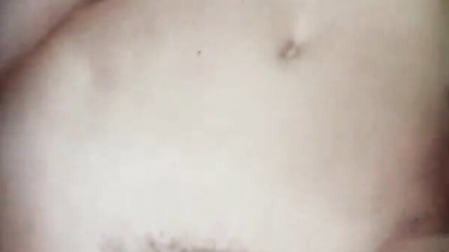 Retro porn closeup of woman's pale breasts with erect nipples