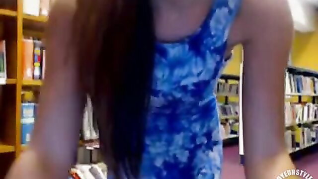 Asian babe in tight blue dress rubs juicy pussy in library