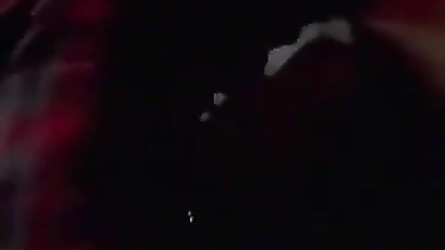 Valentine Demy close-up in red lighting, seductive adult video thumbnail