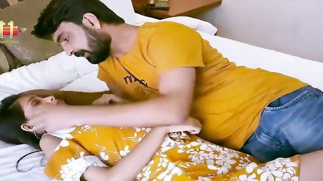 Indian couple in bed, man groping woman passionately