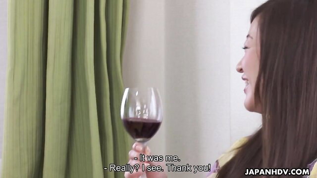 Maria Ono smiling with wine glass, elegant Asian beauty in JAV