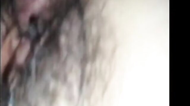 Close-up of a person's hairy genital area