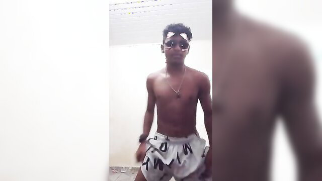 Shirtless young Brazilian boy posing in white shorts, live cam tease