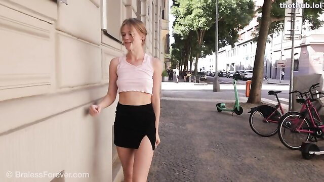 Bitchinbubba Diana in pink crop top and mini skirt walking urban street