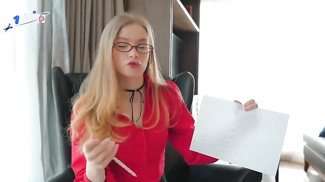 Blonde Diana Rider in red blouse glasses holding paper adult video