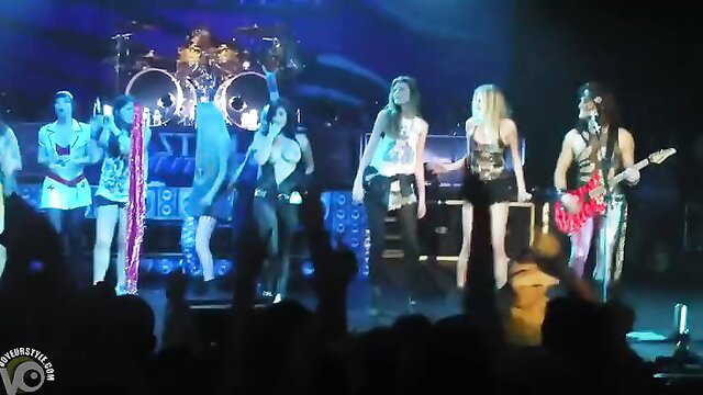 Hot fan girl topless on concert stage with band crowd