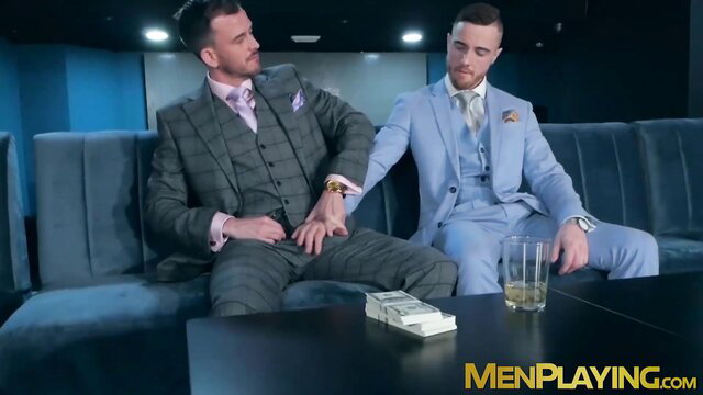Bearded businessmen Franky Fox and JP Dubois in suits with cash
