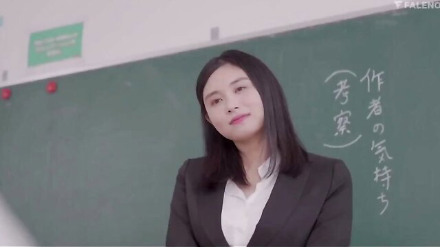 Asian teacher in suit smiles at camera in JAV classroom scene