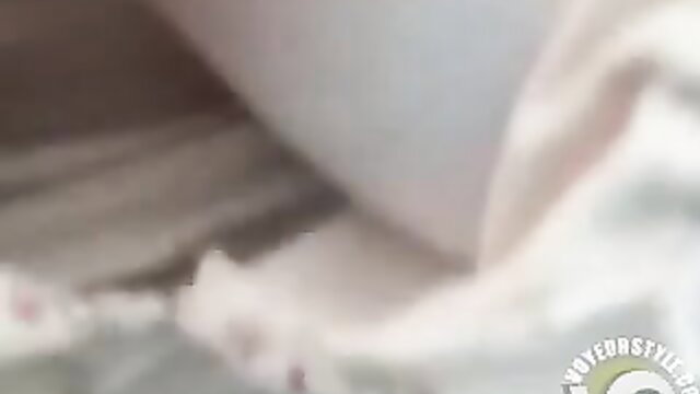 Voyeur two-way mirror cam spies on busty Asian woman changing clothes