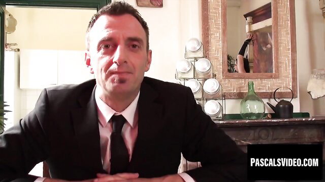 Suited maledom controls busty babe in surrender scene