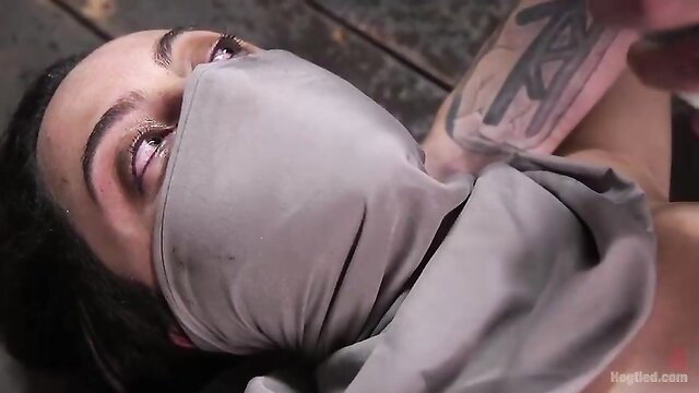 Blindfolded brunette beauty bound and submissive in intense BDSM scene