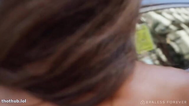 Brunette babe's bare back and shoulders in car flashing tease