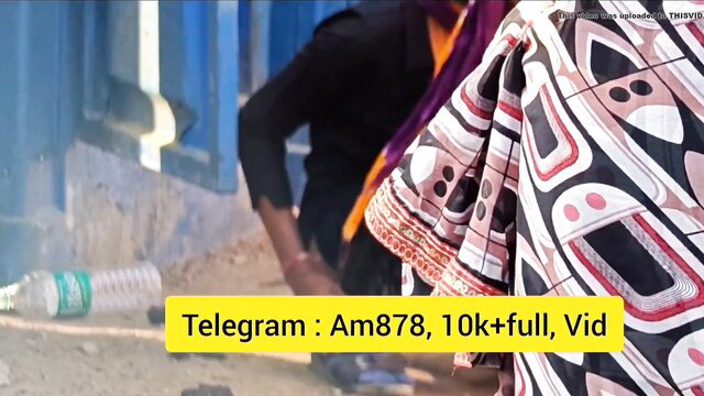 Indian girl in colorful saree squatting outdoors to piss