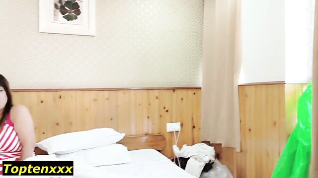 Hot Asian woman in red striped top on bed in steamy cuckold scene