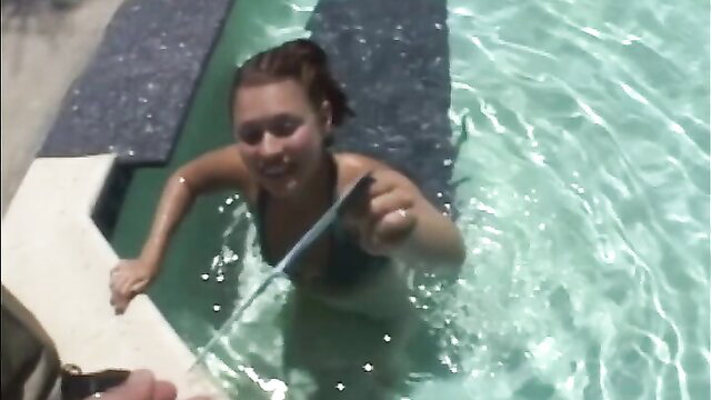 Tina Hot in a pool with a selfie stick