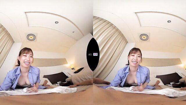 Smiling Asian woman in open blouse exposing tits on bed, sexy JAV thumbnail