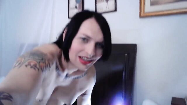 Luna Blue topless with tattoos on cam, pale goth beauty smiling seductively
