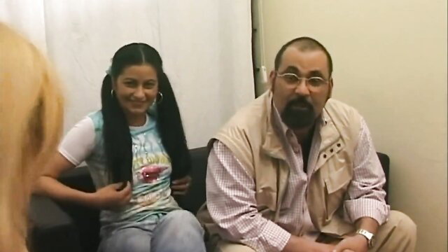 Pierre DJ with young latina pigtails girl in tank top on couch