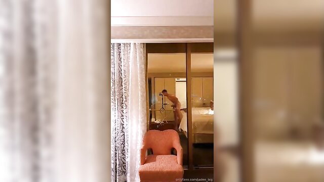 Nude man wanking by hotel window in Natural Born Wanker