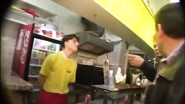 German scat kebab shop teen in yellow shirt red shorts pointed at by man