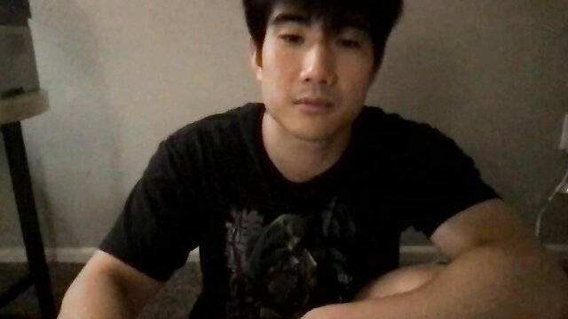 Asian guy in black tee sits relaxed, creamy facial cumshot food video thumbnail