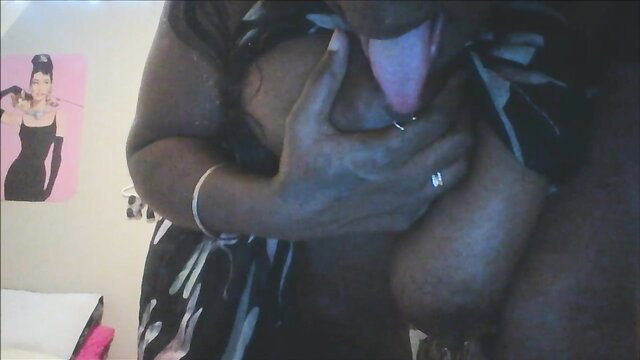Hot ebony slut Mam844 titfucks huge cock with tongue out
