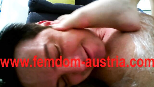 Femdom mistress wraps sub in plastic, slaps and spits on face