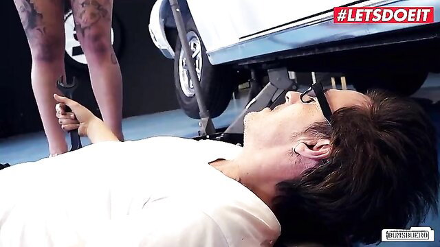 Wild Vicky tattooed legs over car mechanic under car in BUMSBUERO
