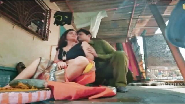 Indian nurse in black top orange skirt passionately kisses man in kurta pajama