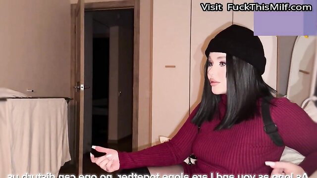 Horny Asian nymph in red sweater and beanie poses seductively in bedroom
